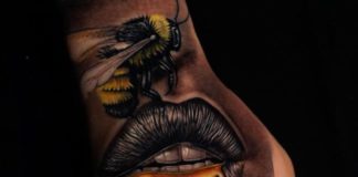Tatouage d'abeille sur lèvre de femme